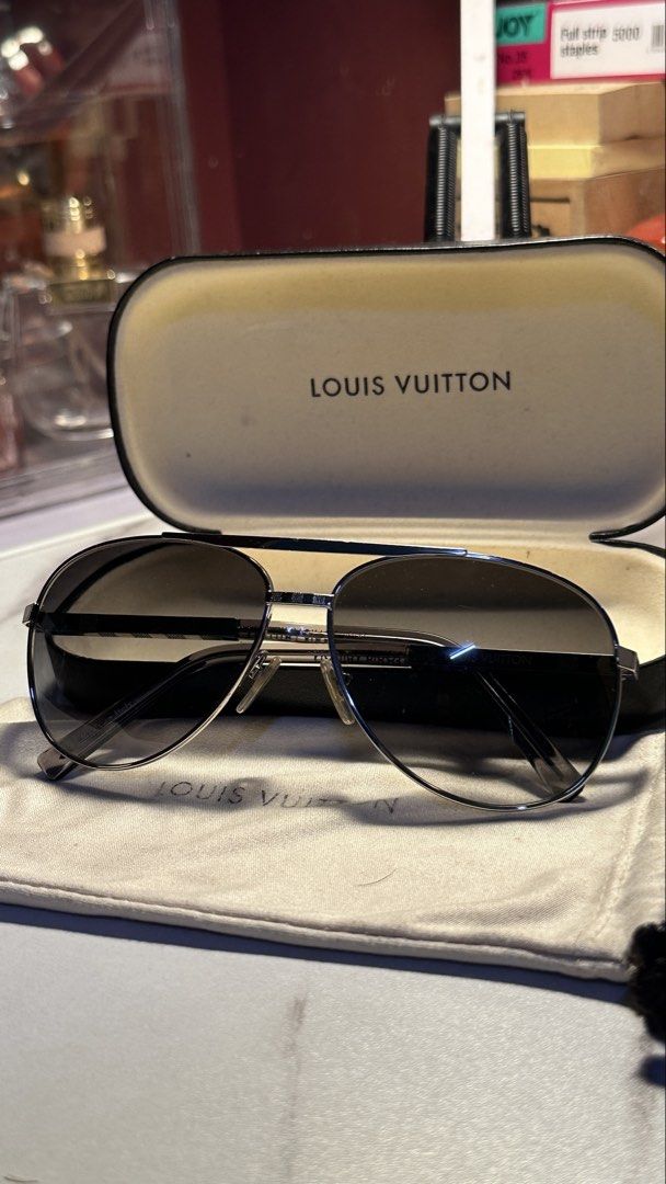 Louis Vuitton VINTAGE Aviator Sunglasses (Category: Sunglasses & Eyewear) located in Manila. Submitted by traversing_life (Listing ID 1463954476, Image 2). Description: - Authentic Louis Vuitton Aviator Sunglasses - Frame Color: Silver - Lens Type: Gradient Lenses - Includes Original Case and Dust Pouch - Versatile for everyday or special occasions - Vintage - From japan - negiotable price.