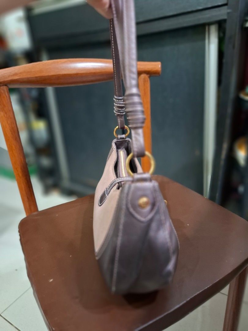 lovcat Heart Charm Shoulder Bag (Category: Shoulder Bags) located in Cavite. Submitted by mahthriftshop (Listing ID 1463982860, Image 3). Description: - Cute Lovcat shoulder bag - Signature heart charm included - Zipper closure for security - Adjustable strap for comfort - Ideal for everyday use - Minor signs of wear on leather trim.