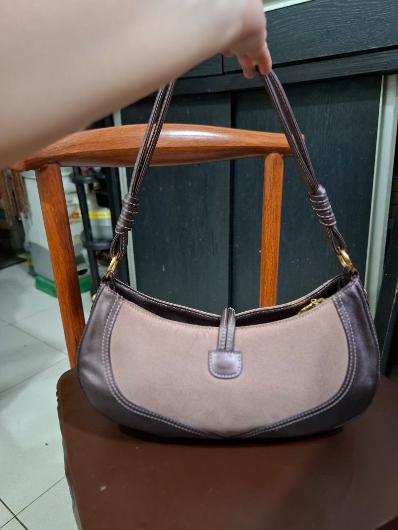 lovcat Heart Charm Shoulder Bag (Category: Shoulder Bags) located in Cavite. Submitted by mahthriftshop (Listing ID 1463982860, Image 2). Description: - Cute Lovcat shoulder bag - Signature heart charm included - Zipper closure for security - Adjustable strap for comfort - Ideal for everyday use - Minor signs of wear on leather trim.