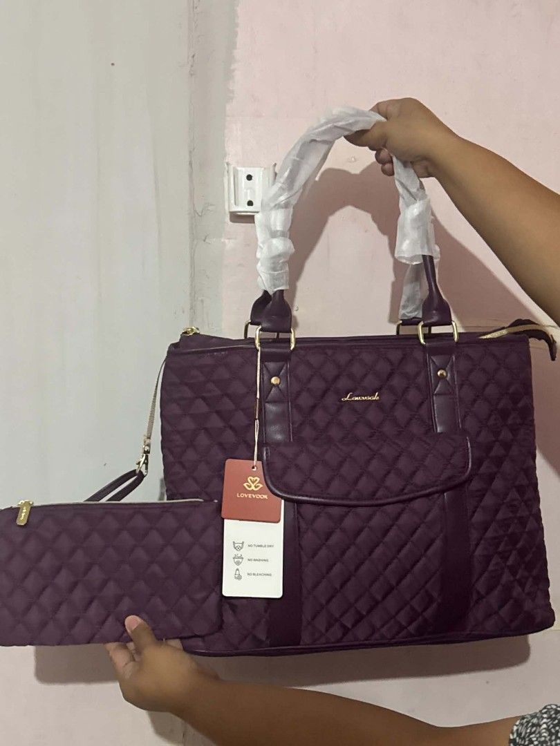 Lovevook Quilted Tote Bag (Category: Tote Bags) located in Manila. Submitted by vsballeras1984 (Listing ID 1464066737, Image 1). Description: - Stylish plum quilted tote bag from Lovevook. - Comes with a matching zippered pouch. - Elegant gold hardware details. - Handles still protected with original plastic wrap. - Features a front flap pocket and secure zip top closure. - Convenient side pockets for easy access. - Ideal for everyday errands or 