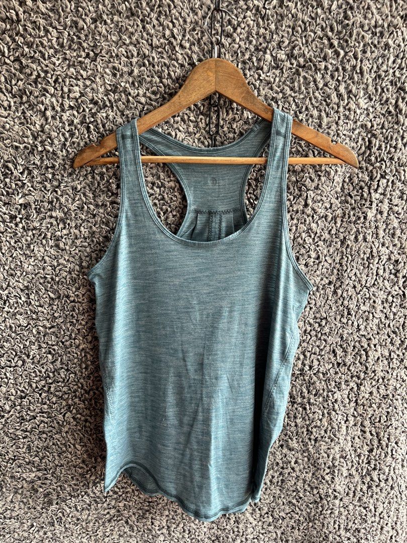 Lululemon Essential Tank | Size 10 (Category: Shirts) located in General Trias. Submitted by zrchustle.604 (Listing ID 1463954332, Image 1). Description: Lululemon Essential Tank in a heathered green/teal shade, most likely Heathered Persian Blue or Heathered Deep Green. It is made from a lightweight, sweat-wicking Seriously Light™ Luon fabric and features a scoop neckline, a loose silhouette with a curved hemline, and distinct pleated detailing 