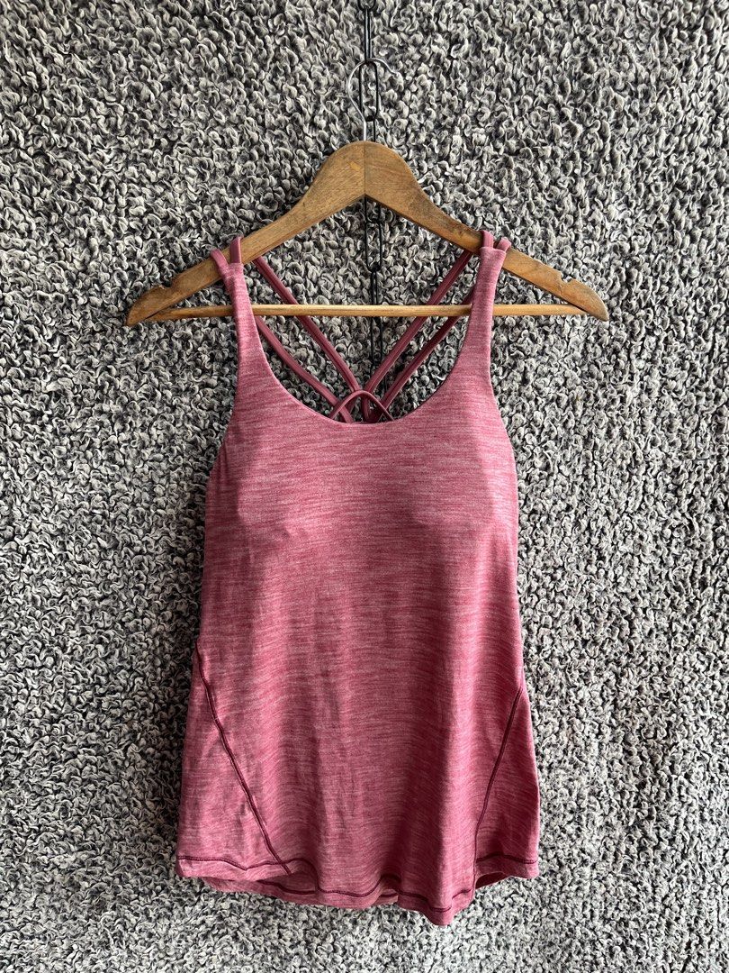 Lululemon Sunset Salutation Tank | Size 4 (Category: Shirts) located in General Trias. Submitted by zrchustle.604 (Listing ID 1463954853, Image 1). Description: Lululemon Sunset Salutation Tank in the heathered cranberry colorway. This athletic piece features a scoop neckline, a flared, flowy lower hem, and a distinctive built-in sports bra with multiple crisscrossing spaghetti straps at the back..