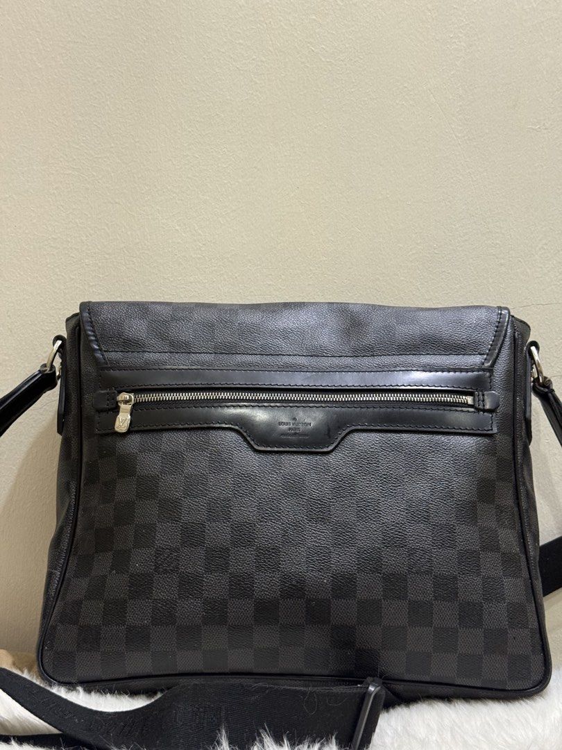 Louis Vuitton Damier Graphite District Messenger Bag (Category: Sling Bags) located in Quezon City. Submitted by clazzystudio (Listing ID 1464022647, Image 3). Description: Selling this classic Louis Vuitton District messenger bag crafted in iconic Damier Graphite check coated canvas with black leather trim and a wide, adjustable web shoulder strap. Designed with a sleek front flap and magnetic closure, this versatile crossbody messenger is perfe