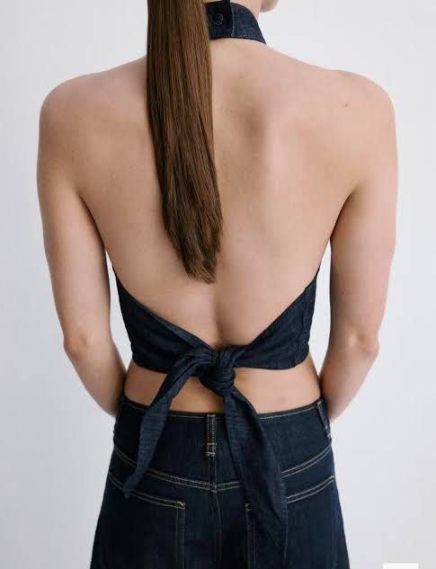 Mango Dark Wash Denim Halter Neck (Category: Sleeveless) located in Manila. Submitted by cheska.closet18 (Listing ID 1464133624, Image 3). Description: - Dark wash denim halter neck crop top - Unique tie-back detail - Soft and comfortable fabric - Perfect for casual or dressed-up looks - Easily pairs with jeans or skirts - A versatile wardrobe essential.