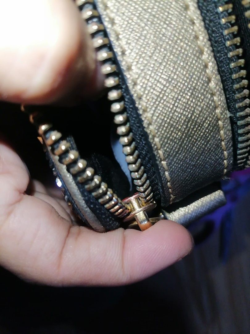 Marc Jacobs Glitter Camera Bag (Category: Luxury Bags & Wallets) located in Digos. Submitted by crodualady82694 (Listing ID 1463983920, Image 3). Description: - Brand: Marc Jacobs - Color: Black with all-over gold glitter - Hardware: Signature double J logo - Closure: Zip - Strap: Detachable crossbody strap - Origin: Made in China - Style: Perfect for nights out or adding a touch of sparkle to any outfit.