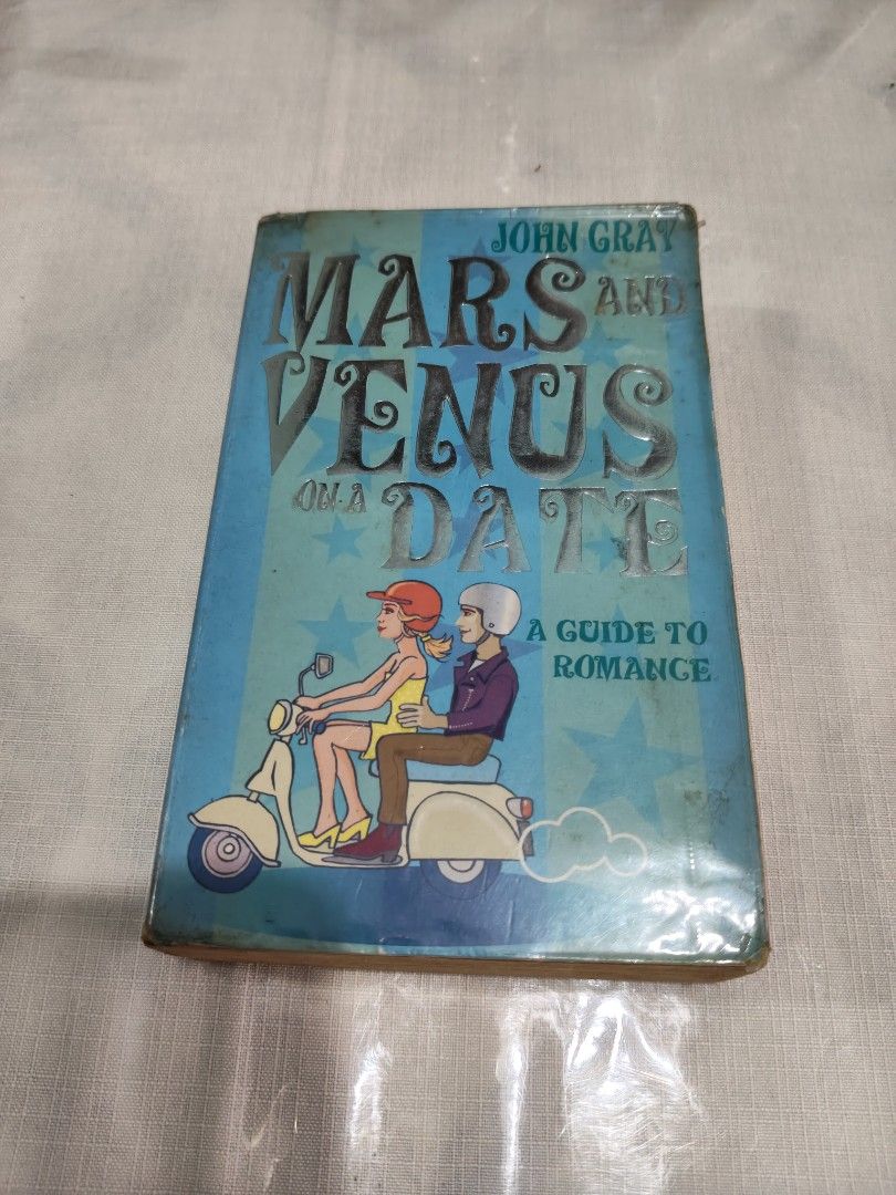 Mars and Venus on a Date by John Gray (Category: Storybooks) located in Mandaluyong City. Submitted by locolady (Listing ID 1464065121, Image 1). Description: - Title: Mars and Venus on a Date by John Gray - Topic: A guide to romance and understanding relationships - Cover: Features a couple riding a scooter - Ideal for: Anyone seeking to improve their understanding of relationships - Condition: Great read.