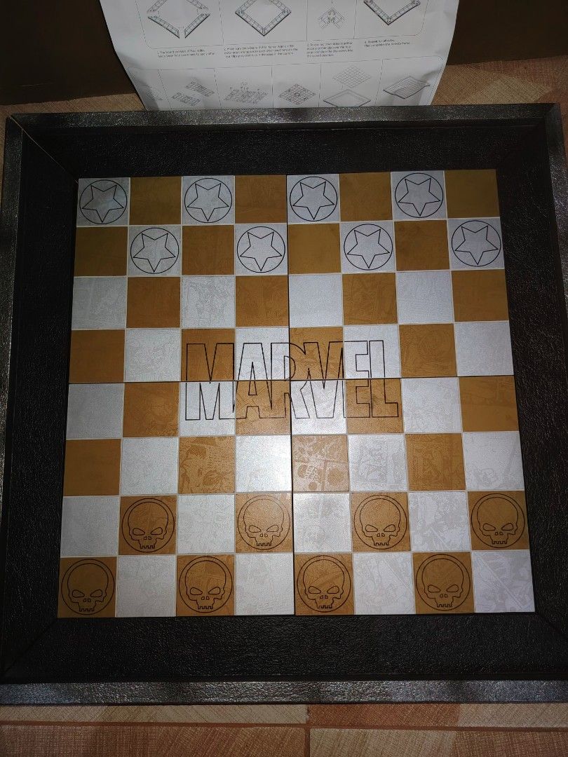 Marvel Eaglemoss Chess Collection 3D Chess Board (Category: Board Games & Puzzles) located in Santiago. Submitted by aceheart0118672 (Listing ID 1464062382, Image 3). Description: - Unique Marvel Chess Board - Features Marvel logo in the center - Skull designs on outer squares - All assembly parts and instructions included - Ideal for Marvel fans and chess enthusiasts - A great addition to any collection.