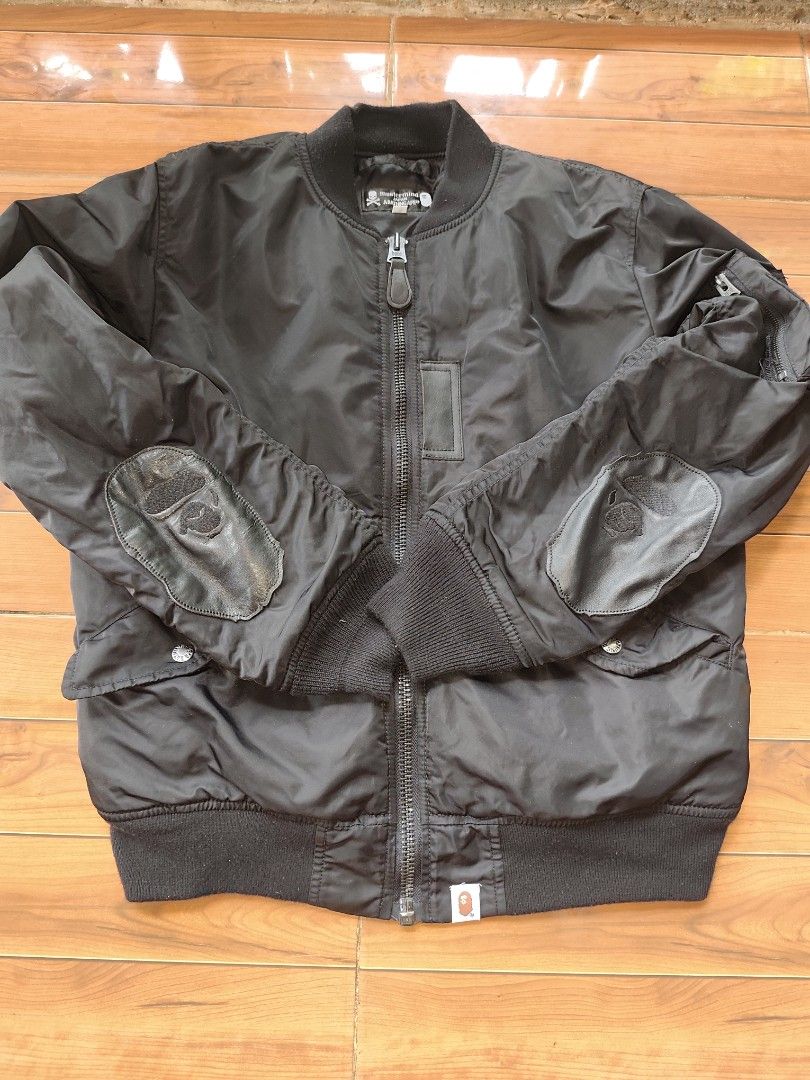 Mastermind Japan x A Bathing Ape Bomber Jacket (Category: Coats, Jackets and Outerwear) located in Manila. Submitted by truefish-1928 (Listing ID 1464137010, Image 1). Description: - Mastermind Japan x A Bathing Ape collaboration bomber jacket. - Features premium leather patches with Bape's signature ape head logo on the sleeves. - Striking large skull and crossbones design prominently displayed on the back. - Comfortable ribbed cuffs and collar 