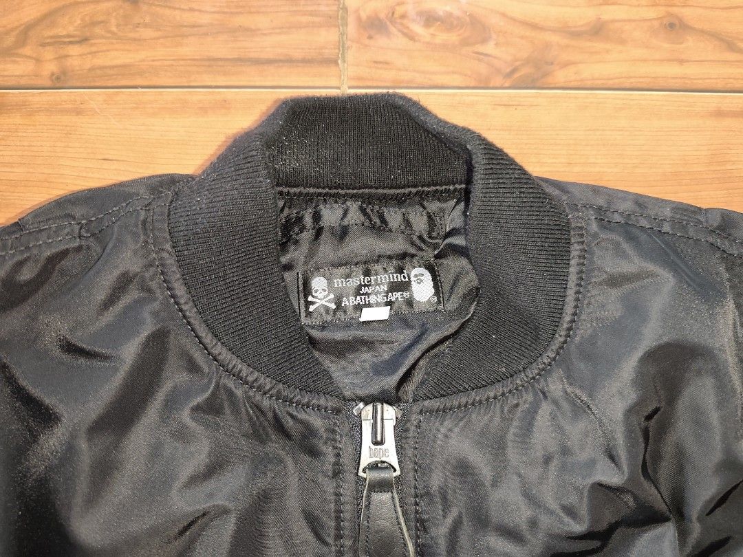 Mastermind Japan x A Bathing Ape Bomber Jacket (Category: Coats, Jackets and Outerwear) located in Manila. Submitted by truefish-1928 (Listing ID 1464137010, Image 3). Description: - Mastermind Japan x A Bathing Ape collaboration bomber jacket. - Features premium leather patches with Bape's signature ape head logo on the sleeves. - Striking large skull and crossbones design prominently displayed on the back. - Comfortable ribbed cuffs and collar 