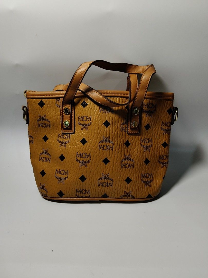 MCM 2 way bag (Category: Luxury Bags & Wallets) located in Valencia. Submitted by coolwolf_27a64f (Listing ID 1463955156, Image 3). Description: NO MAJOR FLAWS GOOD CONDITION DAILY USE ITEM.