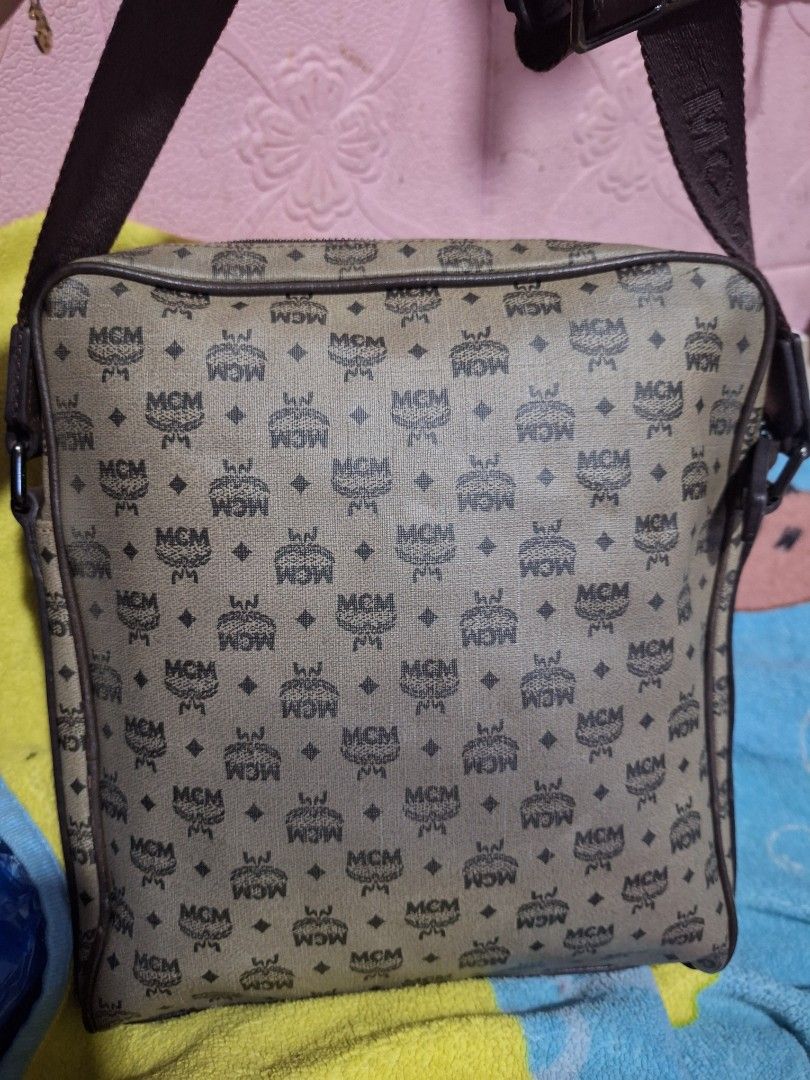 MCM Monogram Crossbody Bag (Category: Luxury Bags & Wallets) located in Quezon City. Submitted by cloudymay (Listing ID 1464111556, Image 2). Description: - Authentic Classic MCM crossbody bag - Signature all-over monogram pattern - Brown leather trim and strap - Zipper closure - Perfect for everyday essentials - Piping issue on 1 corner, but fixed already.