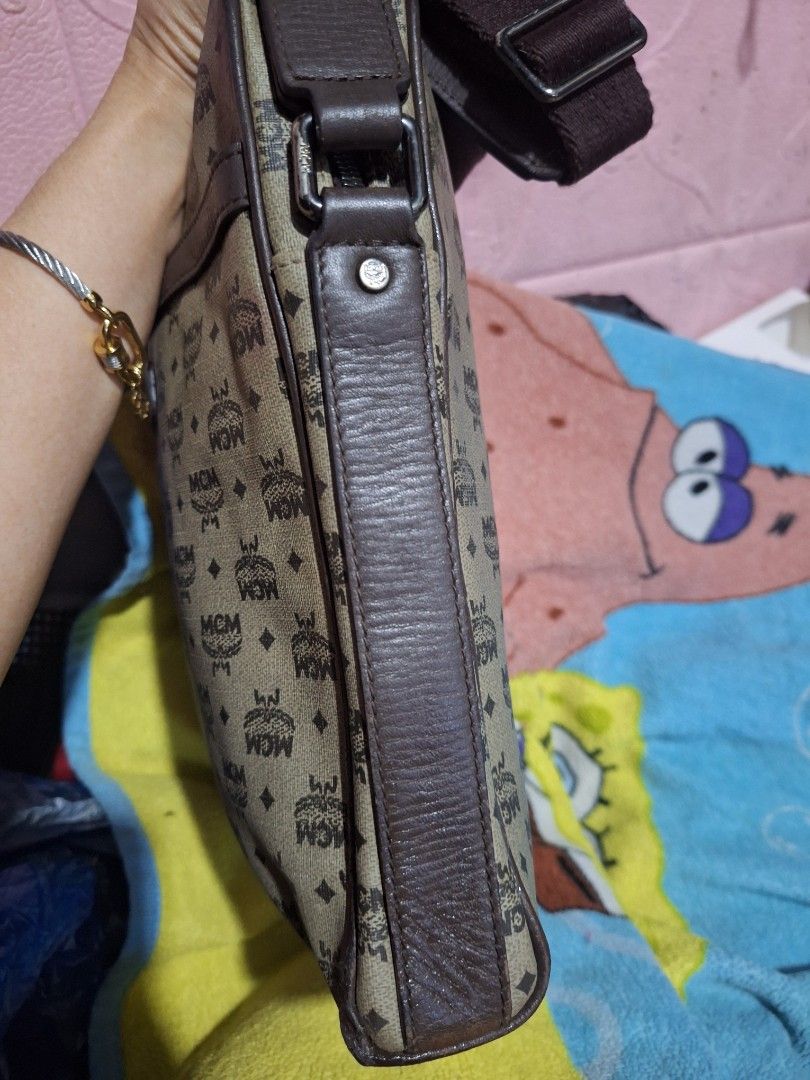 MCM Monogram Crossbody Bag (Category: Luxury Bags & Wallets) located in Quezon City. Submitted by cloudymay (Listing ID 1464111556, Image 3). Description: - Authentic Classic MCM crossbody bag - Signature all-over monogram pattern - Brown leather trim and strap - Zipper closure - Perfect for everyday essentials - Piping issue on 1 corner, but fixed already.