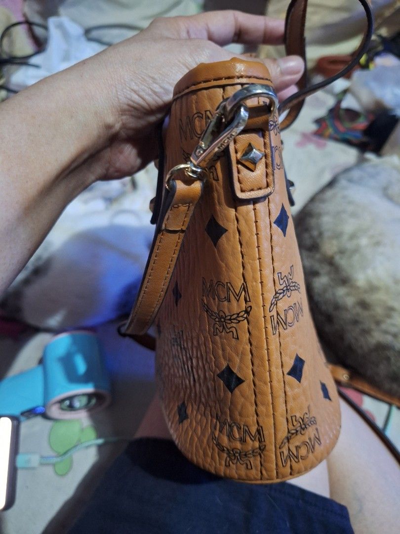 MCM Visetos Monogram Shoulder Bag (Category: Luxury Bags & Wallets) located in Quezon City. Submitted by cloudymay (Listing ID 1464112276, Image 2). Description: - MCM sling bag - Signature Visetos monogram print - Gold-tone hardware - Genuine leather - Leather trim and handles - Stains on interior - Minor wear on strap edges - Ideal for everyday use.