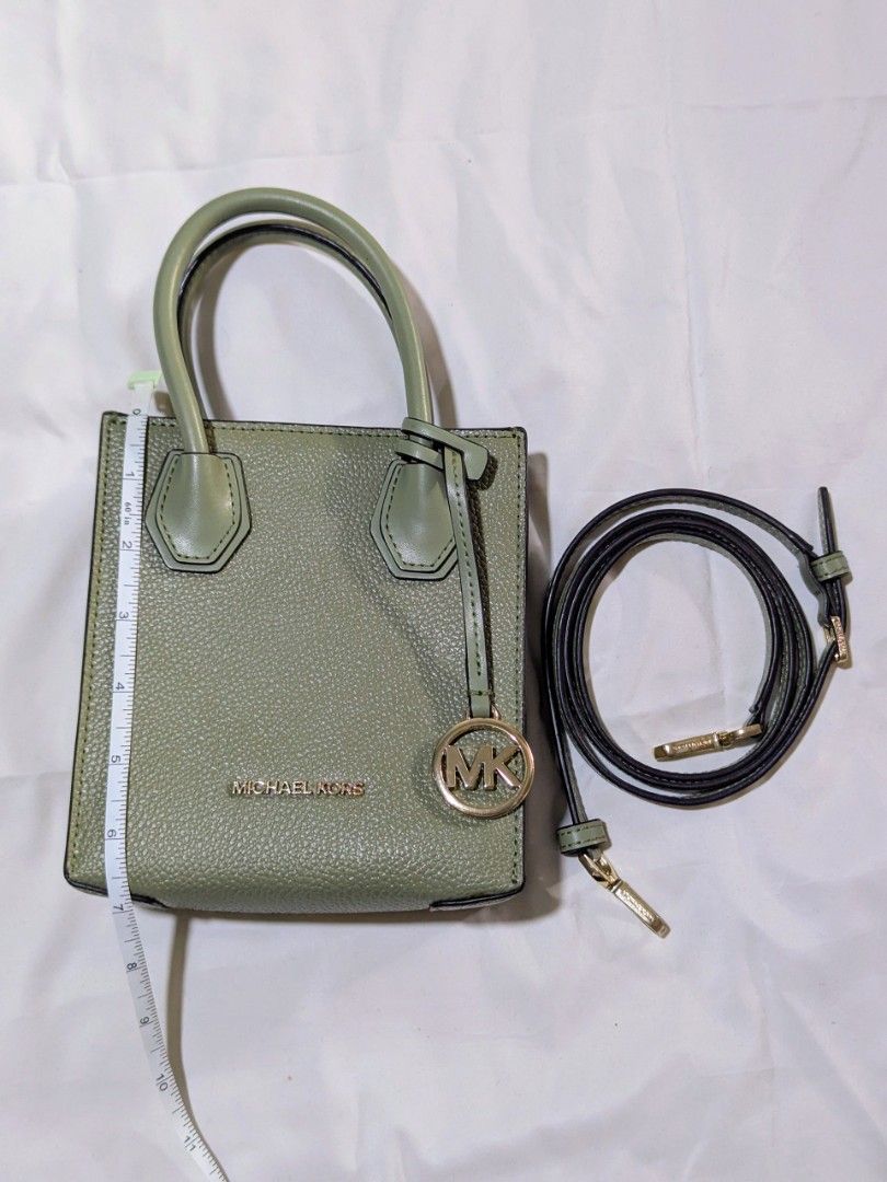 Michael Kors Green Leather Mini Tote Bag (Category: Luxury Bags & Wallets) located in Quezon City. Submitted by kuripotnya (Listing ID 1464059936, Image 1). Description: - Authentic Michael Kors mini tote bag - Color: Green - Material: Pebbled leather - Hardware: Gold details -preloved excellent condition 10/10 - Includes: Detachable crossbody strap - Interior: MK logo lining - Dimensions: Approx. 6" W x 7" H - Ideal for carrying essentials.