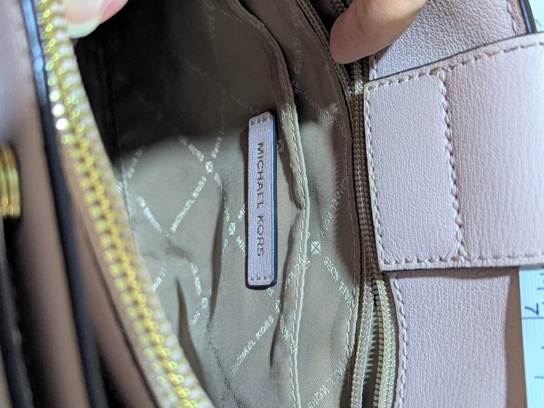 Michael Kors Pink Leather Top Handle Bag (Category: Luxury Bags & Wallets) located in Quezon City. Submitted by kuripotnya (Listing ID 1464062130, Image 3). Description: - Authentic Michael Kors handbag - Beautiful light pink color - Elegant gold hardware accents - Comfortable top handles - includes shoulder/crossbody strap - Secure clasp closure for your belongings - Spacious interior with multiple compartments - Compact size, approximately 10 i