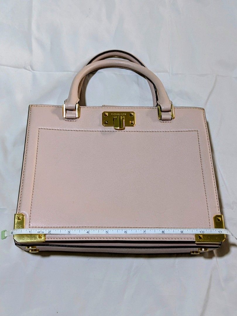 Michael Kors Pink Leather Top Handle Bag (Category: Luxury Bags & Wallets) located in Quezon City. Submitted by kuripotnya (Listing ID 1464062130, Image 1). Description: - Authentic Michael Kors handbag - Beautiful light pink color - Elegant gold hardware accents - Comfortable top handles - includes shoulder/crossbody strap - Secure clasp closure for your belongings - Spacious interior with multiple compartments - Compact size, approximately 10 i