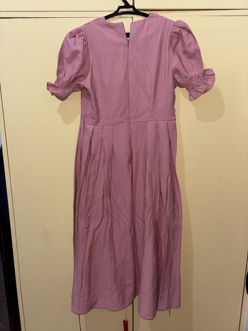 Milkshake Pink Puff Sleeve Button Front Midi Dress (Category: Dresses) located in Cavite. Submitted by 1renek (Listing ID 1464091811, Image 2). Description: Cute pink midi dress. Puff sleeves with ruffled cuffs. Button front detail. Has a tie at the side. Perfect for casual outings or dressing up. Original tag still attached. MOD: Lalamove (Cavite Area), JNT MOP: GCASH MOD: Lalamove (Cavite Area), JNT MOP: GCASH.