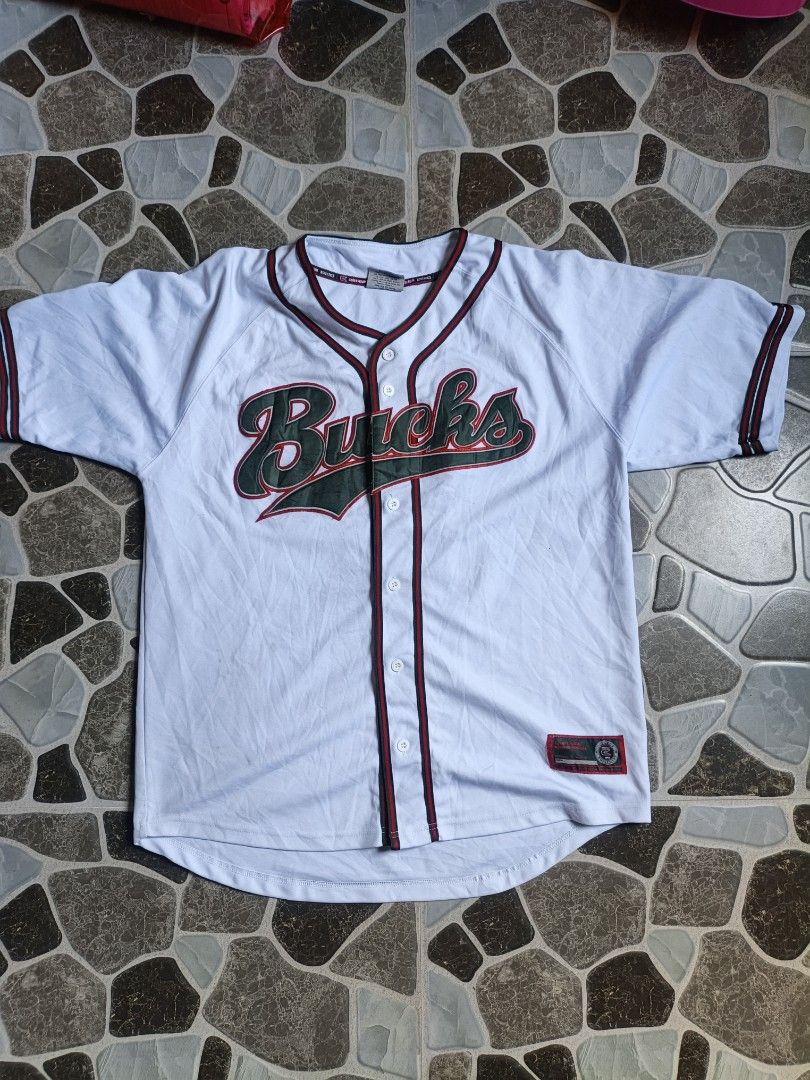 Milwaukee Bucks Baseball Jersey Size XL (Category: Activewear) located in Narvacan. Submitted by picky_looter (Listing ID 1464083819, Image 1). Description: - White Milwaukee Bucks baseball jersey - Features 'Bucks' across the chest - 'Milwaukee' and player number '6' on the back - Brand: College Equipment by Colosseum Athletics - Size: XL - Perfect for any Milwaukee Bucks fan!.