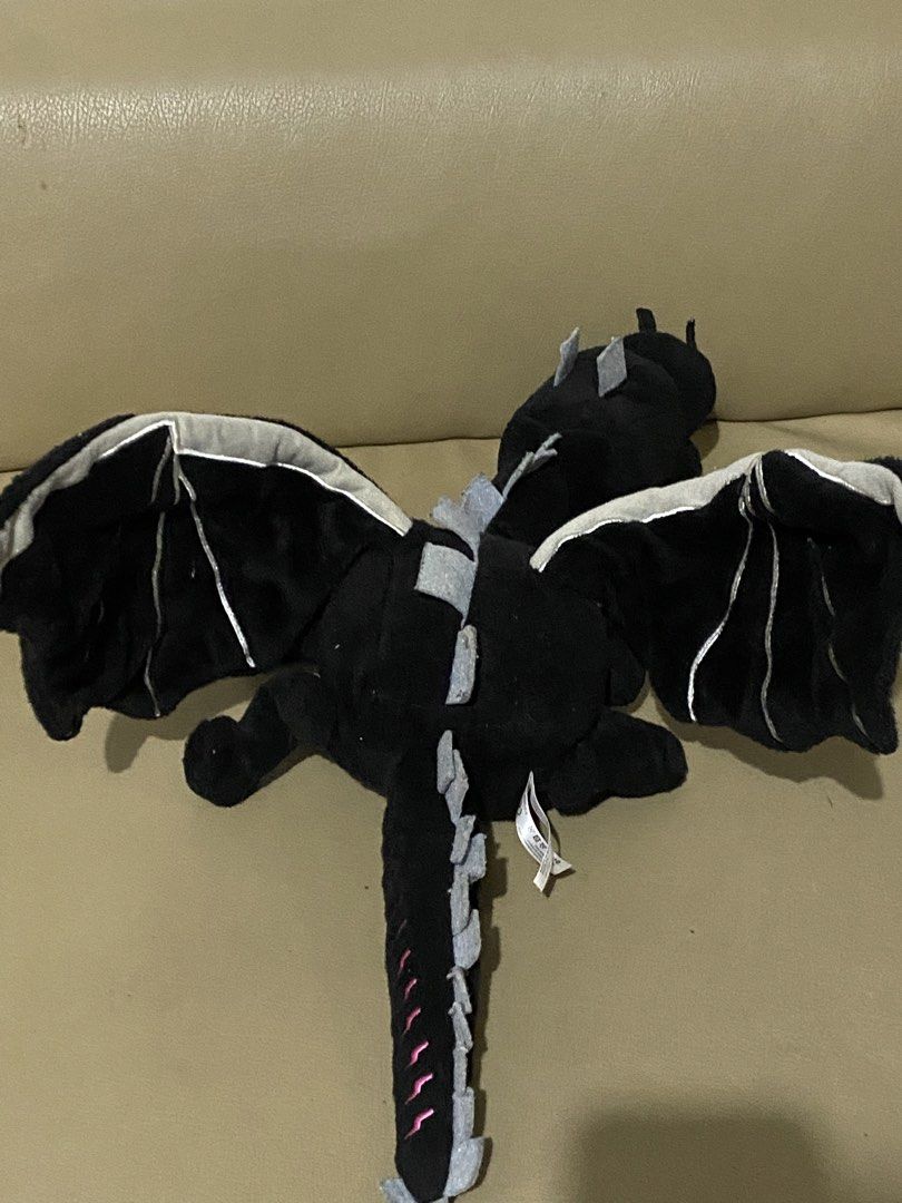 Minecraft Ender Dragon Plush Toy (Category: Plushies & Soft Toys) located in Davao. Submitted by hoowans_surplus (Listing ID 1463953670, Image 2). Description: - Adorable black dragon plush toy - Video game-inspired design - Features wings and a long tail - Super soft and cuddly - Ideal for dragon and gaming fans - Approximate size: [insert length here if known].