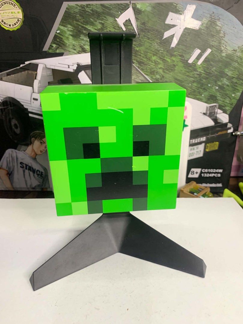 Minecraft torch and headphone holder w/ lights (Category: Action & Battle Toys) located in Maria Aurora. Submitted by zorotoyz (Listing ID 1464020845, Image 2). Description: Minecraft torch with light battery operated Minecraft headphone holder w/ lights type c socket Issue Paint chips .