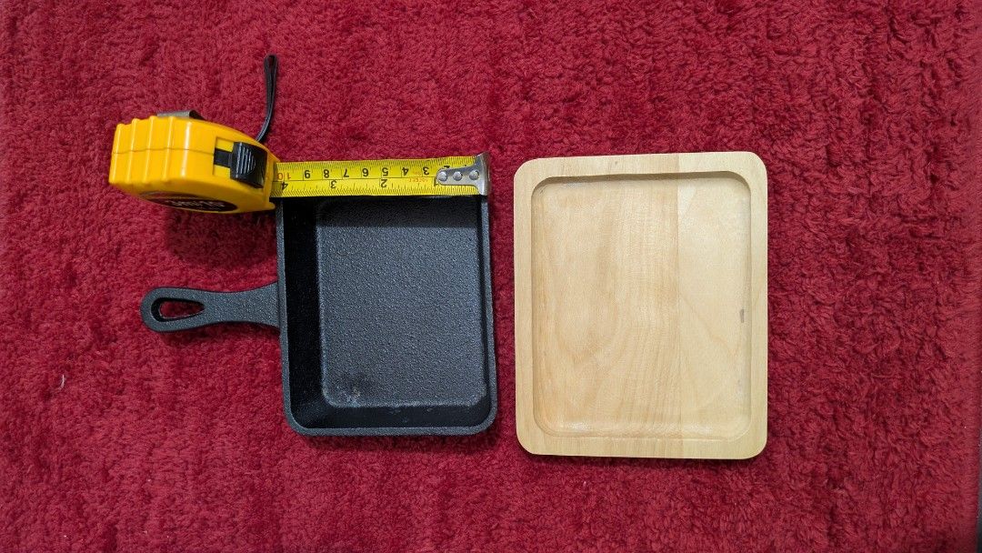 Mini Cast Iron Rectangular Skillet With Wooden Base Campton Gibson Home (Category: Cookware & Accessories) located in Makati City. Submitted by thedeclutterproject2019 (Listing ID 1464126005, Image 1). Description: - Mini cast iron square pan - Includes wooden base - Ideal for serving individual portions - Pan dimensions: approx. 4" x 4" - Wooden base is also square - Brand new, never used - Still in original packaging with silica gel packet. RFS