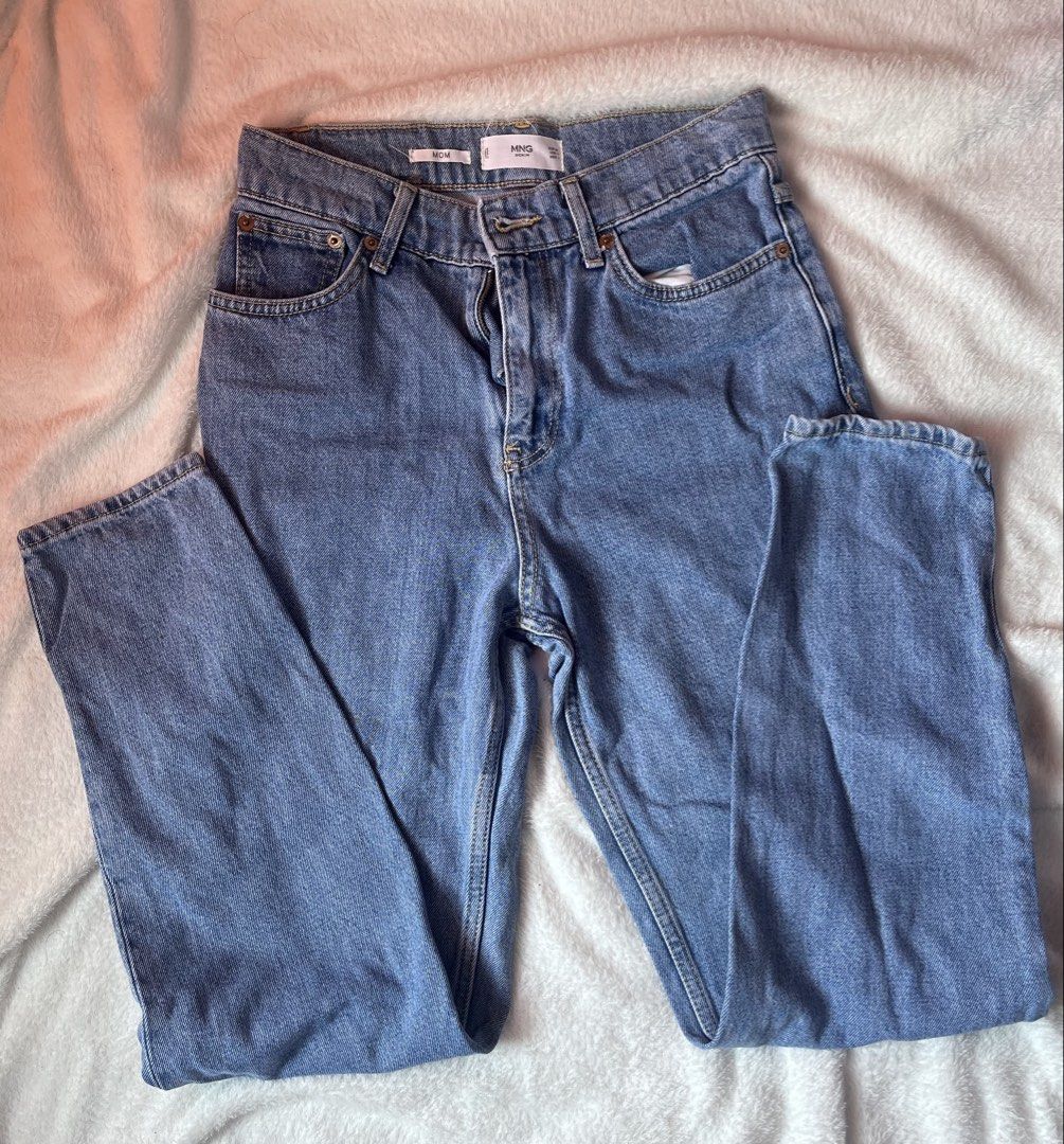 MNG Mom Jeans Light Wash Denim (Category: Jeans) located in Cabuyao City. Submitted by jei_gspr (Listing ID 1463955149, Image 1). Description: - MNG light wash mom jeans - Classic five-pocket style - Button and zip closure - Straight leg fit - Versatile for everyday wear and easy to style with any top.