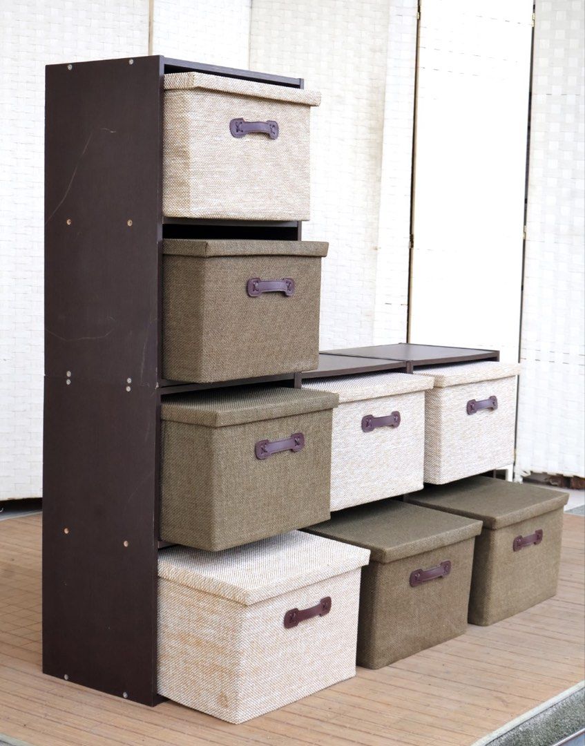 Modular Storage Cube Organizers with Fabric Bins (Category: Storage Boxes & Baskets) located in Bulacan. Submitted by FurnitureGallery (Listing ID 1463996852, Image 2). Description: - Set of modular storage cubes - Includes 9 fabric bins (mix of dark green and light beige) - Sturdy dark brown frame - Stackable and configurable for various storage needs - Perfect for organizing books, toys, and more - Fabric bins feature convenient handles JAPAN S