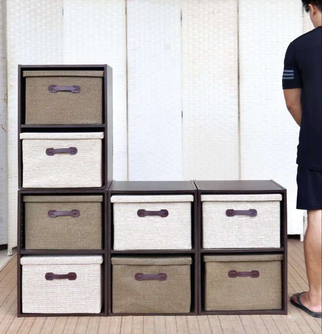 Modular Storage Cube Organizers with Fabric Bins (Category: Storage Boxes & Baskets) located in Bulacan. Submitted by FurnitureGallery (Listing ID 1463996852, Image 1). Description: - Set of modular storage cubes - Includes 9 fabric bins (mix of dark green and light beige) - Sturdy dark brown frame - Stackable and configurable for various storage needs - Perfect for organizing books, toys, and more - Fabric bins feature convenient handles JAPAN S