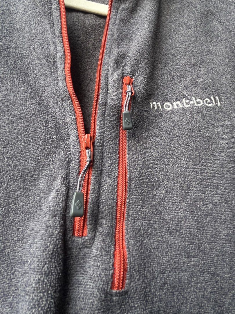 Montbell Grey Fleece 1/4 Zip Pullover Sweater Size M (Category: Coats, Jackets and Outerwear) located in Manila. Submitted by kingjamessthriftt (Listing ID 1464005519, Image 3). Description: - Montbell Fleece Pullover - Color: Grey with red zipper accents - Size: Medium (M) - Features a zippered chest pocket - Ideal for layering or standalone wear - Made in Vietnam.
