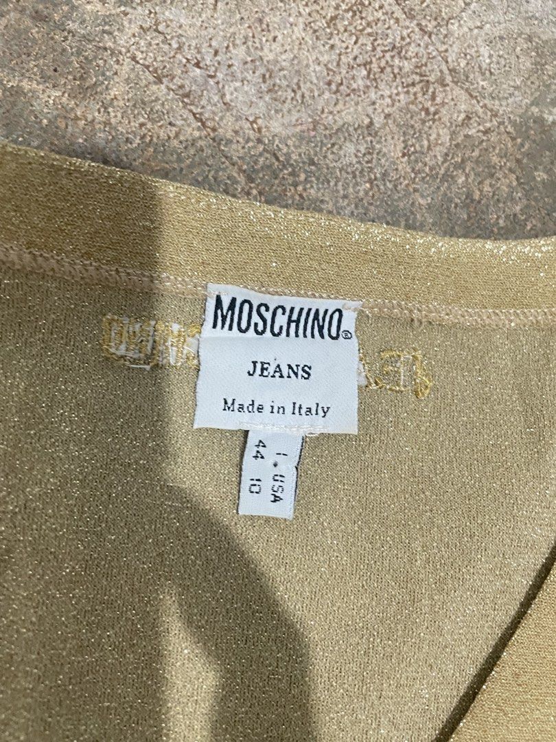 Moschino vintage top (Category: Blouses) located in Davao. Submitted by mj_designervintagecurator (Listing ID 1464050812, Image 3). Description: 📌with some 3 pinholes see photo on shoulder part 📌best fit small to semi med 📌shoulder 14- bust 36- armpit 14- length 21 inches strechy .