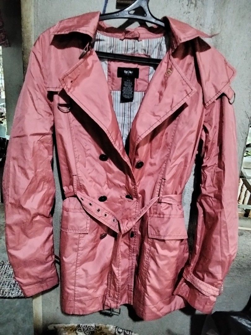 Mossimo Pink Double-Breasted Trench Coat (Category: Coats, Jackets and Outerwear) located in Indang. Submitted by swiftowl_a40469 (Listing ID 1464125967, Image 1). Description: Cute pink trench coat from Mossimo. Double-breasted style with a belt to cinch the waist. Has a striped lining inside. Great for layering over outfits..