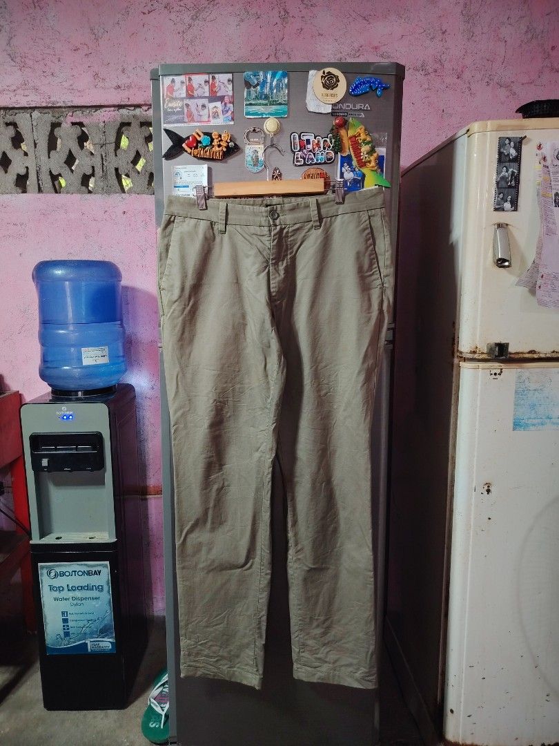 Nautica Khaki Chino Pants (Category: Chinos) located in General Santos City (Dadiangas). Submitted by rafaelmir09800 (Listing ID 1463965151, Image 1). Description: - Brand: Nautica - Color: Khaki - Size 34 on tag, fits 33-35 - Fit: Classic Straight Leg - Closure: Button and zip front - Pockets: Two back pockets with button closure - Style: Versatile for casual or smart casual wear.