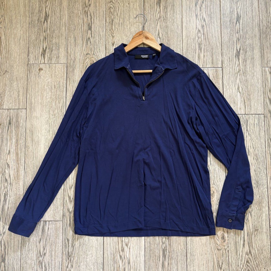 Navy Blue Quarter Zip Long Sleeves (Category: Tshirts & Polo Shirts ) located in Imus. Submitted by reloved.nd (Listing ID 1464073296, Image 1). Description: - Navy blue long sleeve polo shirt by Murano - Features a quarter zip neckline - Classic collar design - Soft and comfortable fabric - Button detail on the cuff - Ideal for casual wear or layering - Sharp and easy to style.
