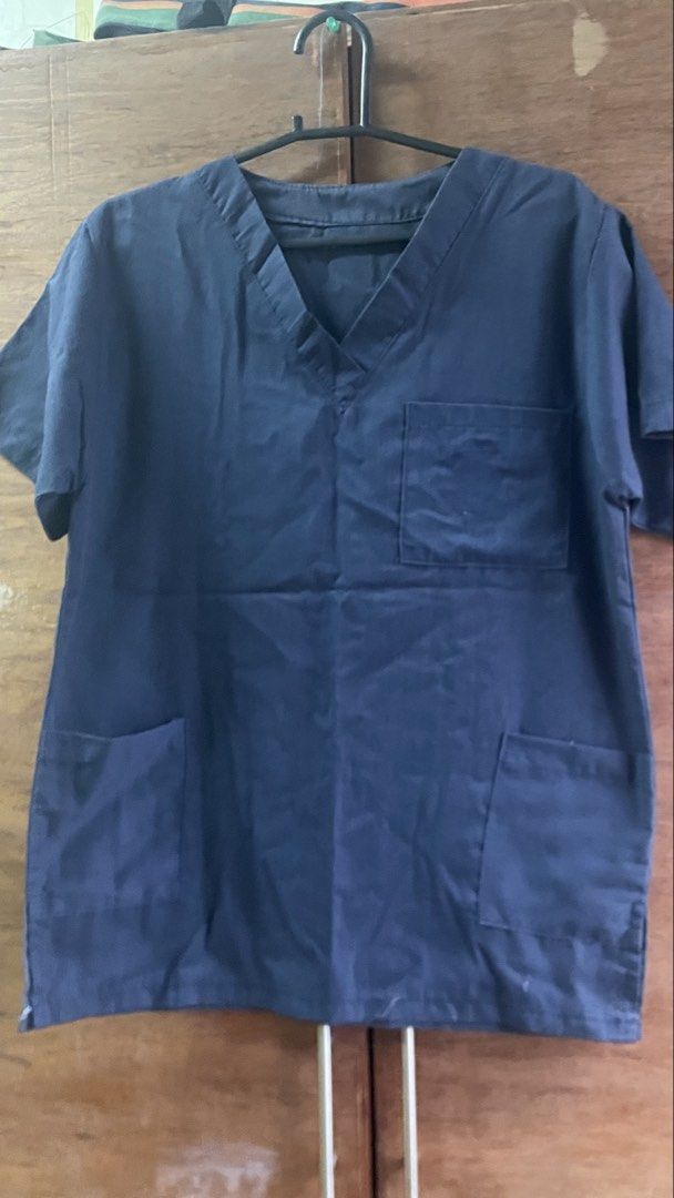 Navy Blue Scrub Top and Pants Set (Category: Sets or Coordinates) located in Manila. Submitted by carolinest97765 (Listing ID 1464044265, Image 2). Description: - Navy blue V-neck scrub top with pockets - Matching scrub pants with elastic waist and drawstring - Comfortable and practical for work - Durable and easy to move in - Ideal for medical professionals and workwear needs.
