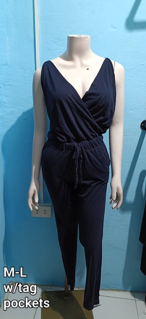 Navy Blue Sleeveless Jumpsuit M-L with Pockets (Category: Jumpsuits) located in Quezon City. Submitted by davidclothing (Listing ID 1464064470, Image 1). Description: - Comfy navy blue jumpsuit - Sleeveless with V-neck wrap front - Elastic waist with drawstring tie - Full length pants - Functional pockets - Size M-L - Brand new with tag.