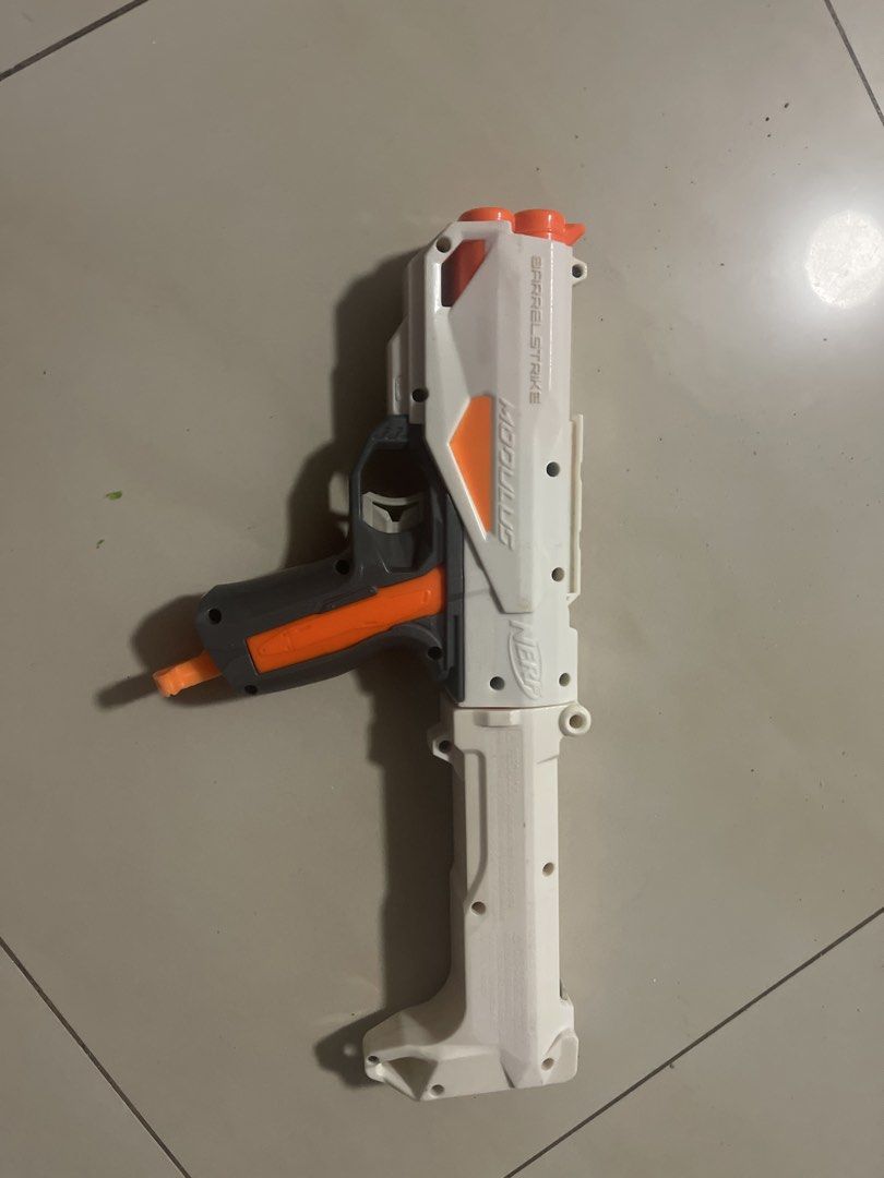 Nerf Modulus Barrelstrike Attachment good condition (Category: Action & Battle Toys) located in Cabanatuan. Submitted by nathaniel_ang (Listing ID 1464035311, Image 2). Description: - Nerf Modulus Barrelstrike toy gun - Color: White and Orange - Includes stock attachment - Great for play - Minor scuffs from use - Ready for its next adventure.
