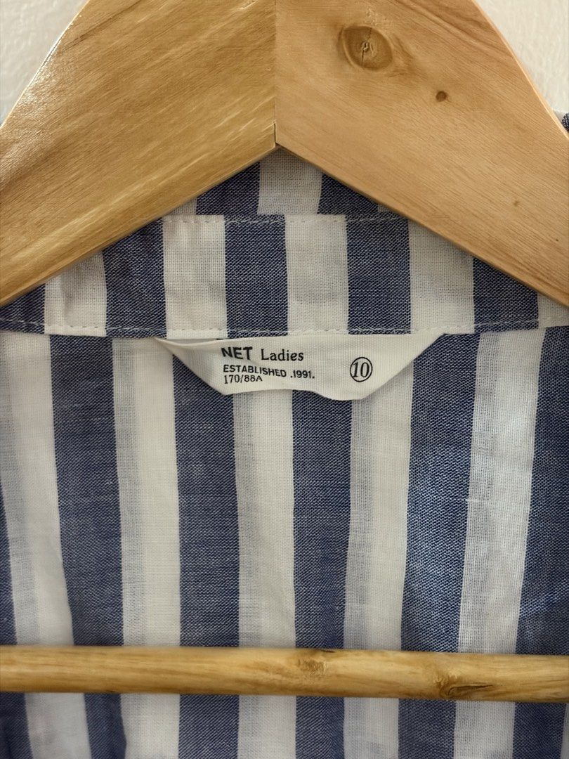 NET Blue and White Striped Button-Up Shirt Size 10 (Category: Blouses) located in San Juan City. Submitted by sel.ler (Listing ID 1463987256, Image 2). Description: - NET Ladies blue and white striped shirt - Size 10 - Short sleeves with rolled cuffs - Two chest pockets with button closures - Button-up front - Ideal for casual wear.