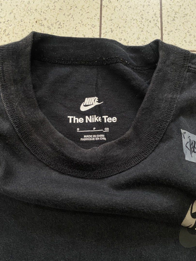 Nike Black Pocket Tee "The Nike Tee" (Category: Tshirts & Polo Shirts ) located in Manila. Submitted by sepamorash53558 (Listing ID 1464051687, Image 3). Description: - Black Nike T-shirt - Features a chest pocket - Multiple Nike logos on chest - 100% Cotton - Size S - Ideal for casual wear.