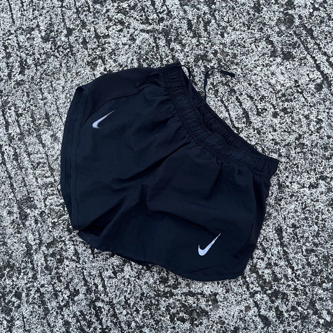Nike Black Running Shorts (Category: Activewear) located in Cauayan. Submitted by onethriftnegros (Listing ID 1464066668, Image 2). Description: - Black Nike running shorts - Lightweight material - Drawstring waist for adjustable fit - Iconic Nike swoosh logo on both legs - Ideal for running, workouts, or casual wear - Comfortable and breathable design.