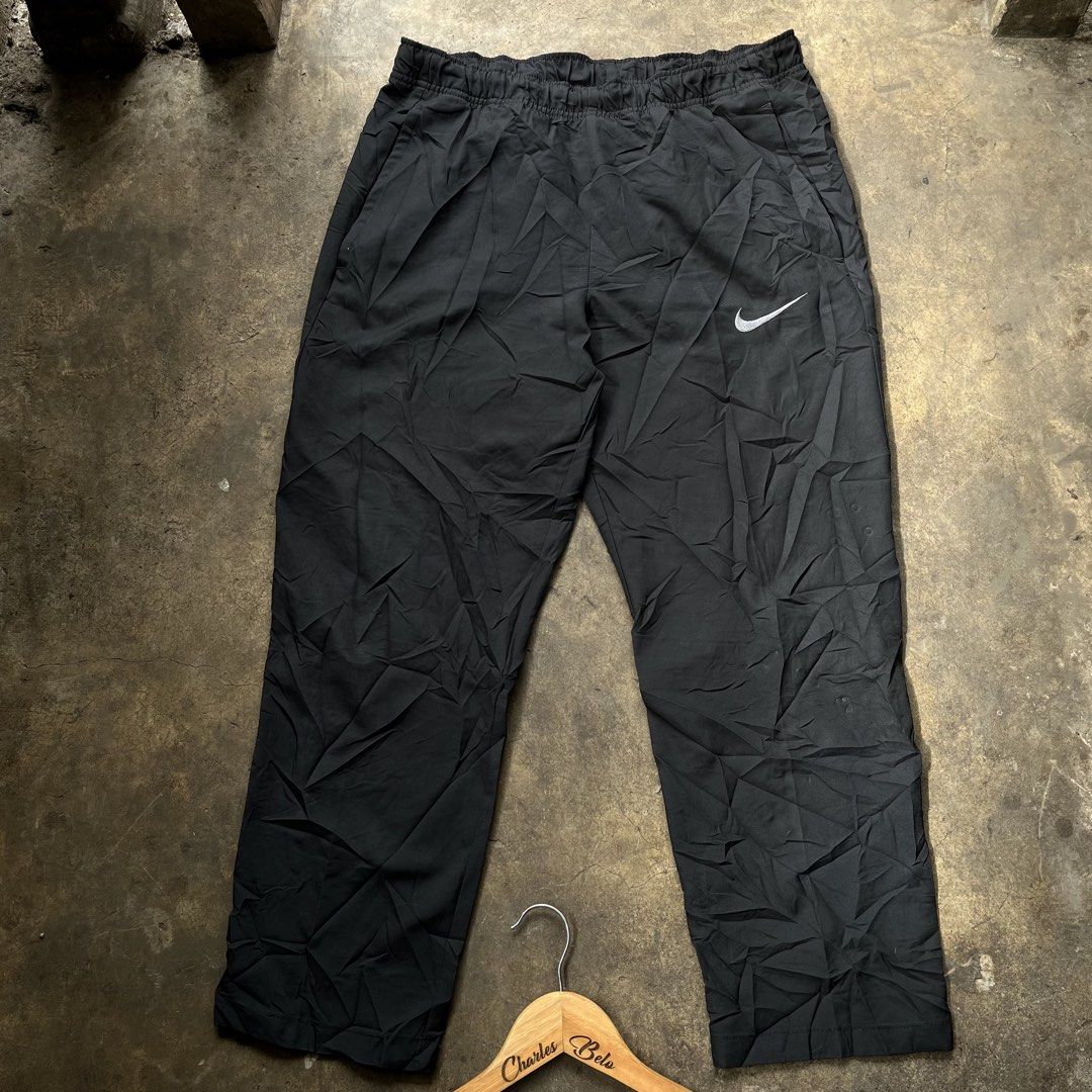 Nike Dri-Fit Black Track Pants (Category: Joggers) located in Davao. Submitted by charlesole52665 (Listing ID 1463948705, Image 1). Description: - Black Nike Dri-Fit Track Pants - Size: XL on tha - Waistline: 32-36 on tape - Length: 36 inch - Leg opening: 7.5 - Features elastic waistband with drawstring - Perfect for workouts or casual wear - Made in China.
