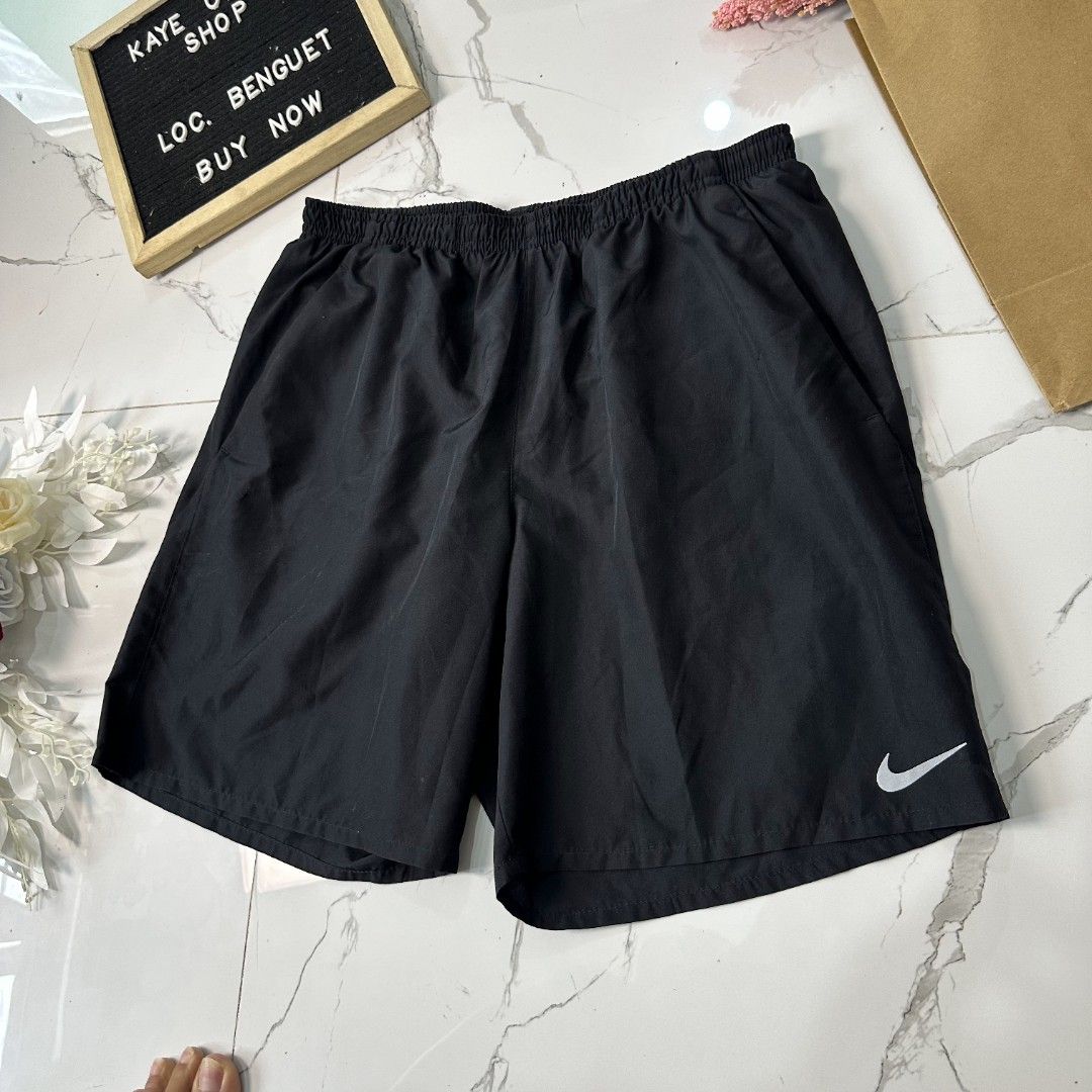Nike Dri-fit Shorts (Category: Shorts) located in Baguio. Submitted by kayeonlineshop (Listing ID 1463997326, Image 2). Description: black athletic shorts featuring the classic white Nike Swoosh logo on the left hem w28-34 L17.5 h24.