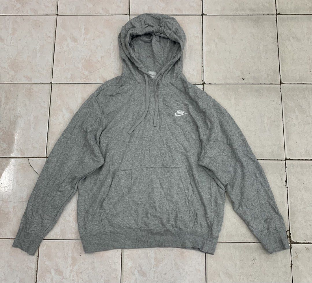 Nike Grey Hoodie Pullover Sweatshirt XXL (Category: Hoodies) located in Cebu City. Submitted by jkeive (Listing ID 1463963717, Image 1). Description: - Grey Nike Hoodie - Size: XXL - Best fit XL (23x28) Dimension - Material: 80% Cotton, 20% Polyester (Body); 100% Polyester (Hood Lining) - Features: Embroidered Nike logo on chest, front kangaroo pocket, adjustable hood drawstrings - Origin: Made in China - Ideal for: Casual wear, everyday comfort.