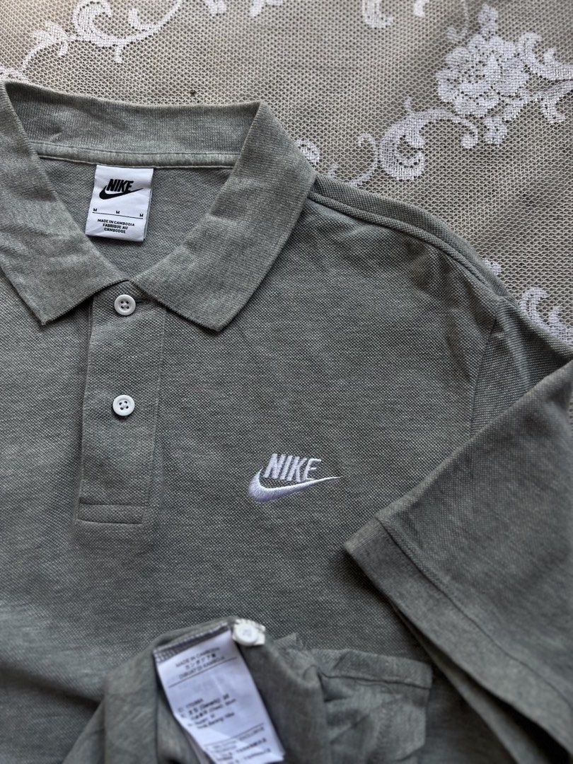 Nike Grey Polo Shirt - Size M (Category: Tshirts & Polo Shirts ) located in Manila. Submitted by trustedmichael. (Listing ID 1464078073, Image 1). Description: Nike club mens/ Cement grey W 21 L 27 M on Tag ✅Excellent ✅Can do vc for item checking/assurance - Classic embroidered Nike swoosh logo on chest - Two-button placket - Made from comfortable fabric - Perfect for casual wear or a sporty look - Versatile and easy to pair with any outfit.