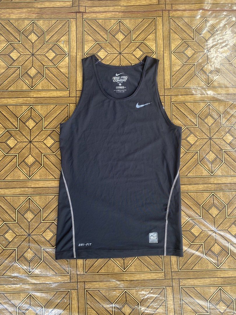 Nike Pro Combat Black Sleeveless Compression Dri-fit (Category: Activewear) located in Pozorrubio. Submitted by eyannn. (Listing ID 1463939167, Image 1). Description: Excellent Condition Color rate 9/10 Issue: crack print sa logo(unnoticeable) Large on tag (Strechable) waist: 16 length: 26.