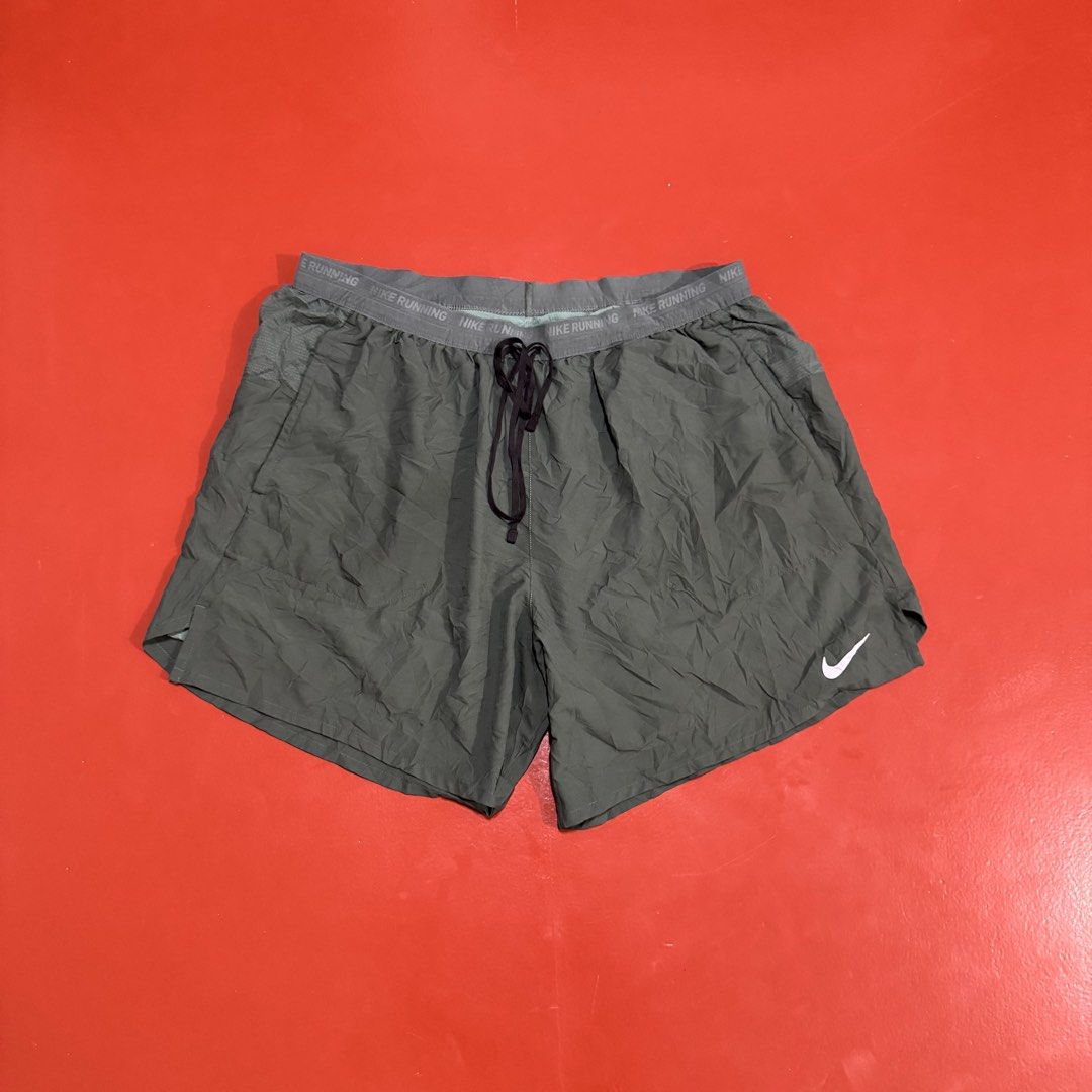 NIKE RUNNING SHORTS (Category: Shorts) located in Pasig City. Submitted by buzzthrifty (Listing ID 1463950798, Image 2). Description: SIZE 32-38WAIST 15.5" LENGTH 13" LEG HOLE EXCELLENT CONDITION .