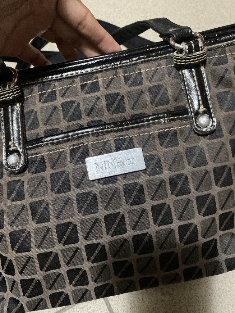 Nine & Co. by Nine West (Category: Shoulder Bags) located in Dagupan City. Submitted by maryennie (Listing ID 1464000887, Image 2). Description: Working zippers (all) Spacious interior Structured design Suitable for work, daily use or travel -Condition: Pre-loved, with visible signs of use such surface scratches/scuffs and some wear on the silver hardware. Please refer to photos for exact condition. ⭐️Selling as-is. Please inspect photos carefull