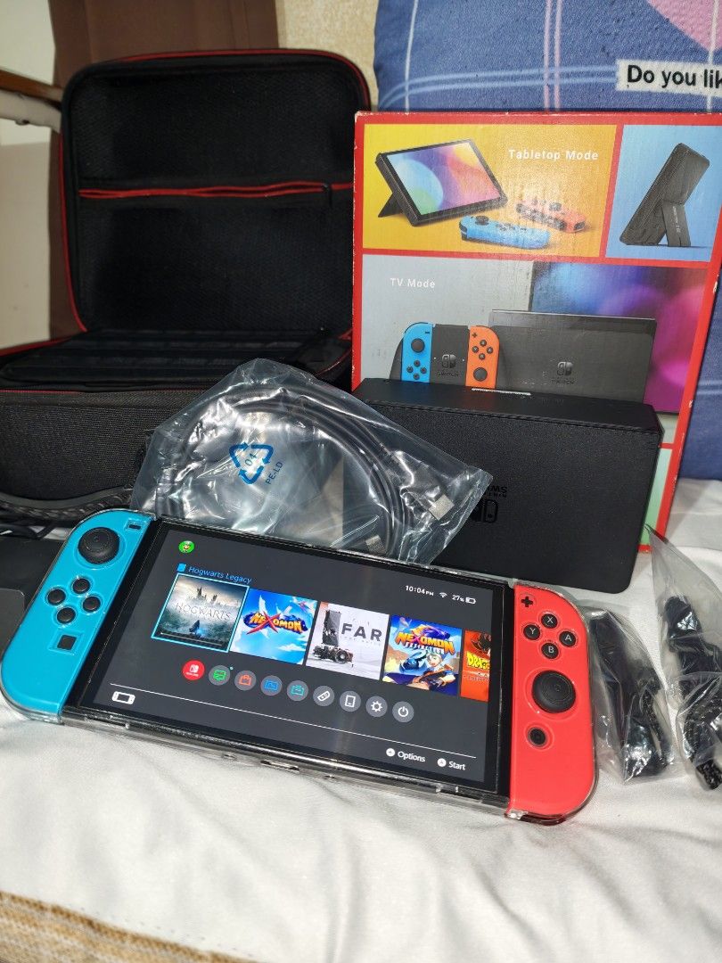 Nintendo Switch Oled (Category: Nintendo) located in Muntinlupa City. Submitted by Mark_Arkin (Listing ID 1463942337, Image 1). Description: 📦 COMPLETE ORIGINAL SET ✅ Nintendo Switch OLED Console ✅ Joy-Con (L) and Joy-Con (R) ✅ 2 Joy-Con Straps ✅ Joy-Con Grip ✅ Nintendo Switch Dock with LAN Port ✅ High-Speed HDMI Cable ✅ Nintendo Switch AC Adapter ✅ Original Box ✅ 64 gb Internal Memory + ✅ Transparent Tpu Case ✅ Travel Case ✅ Game Cart only Drag