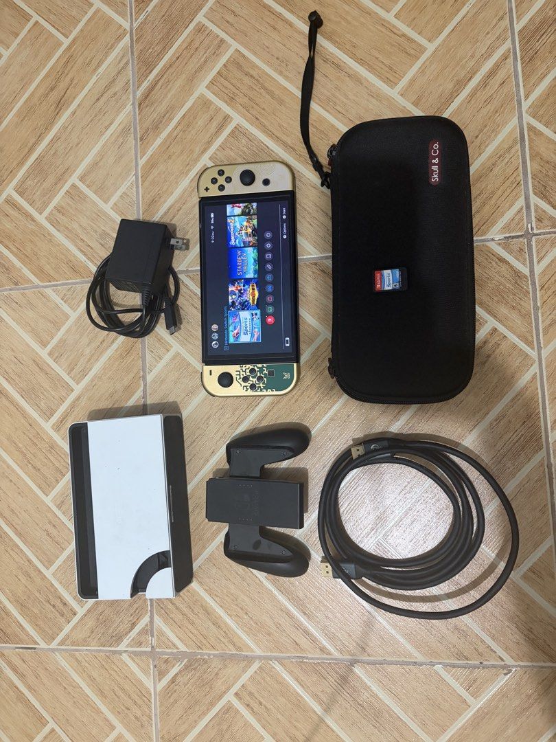 Nintendo Switch OLED Console with Accessories and Case (Category: Nintendo) located in Marikina City. Submitted by pong15 (Listing ID 1464062814, Image 1). Description: - Nintendo Switch OLED Model Console - Original Dock - Joy-Cons (Left & Right) - AC Adapter - HDMI Cable - Skull & Co. Carrying Case - Everything included to start playing immediately - with nintendo sports cartridge - Perfect for both home and on-the-go gaming.