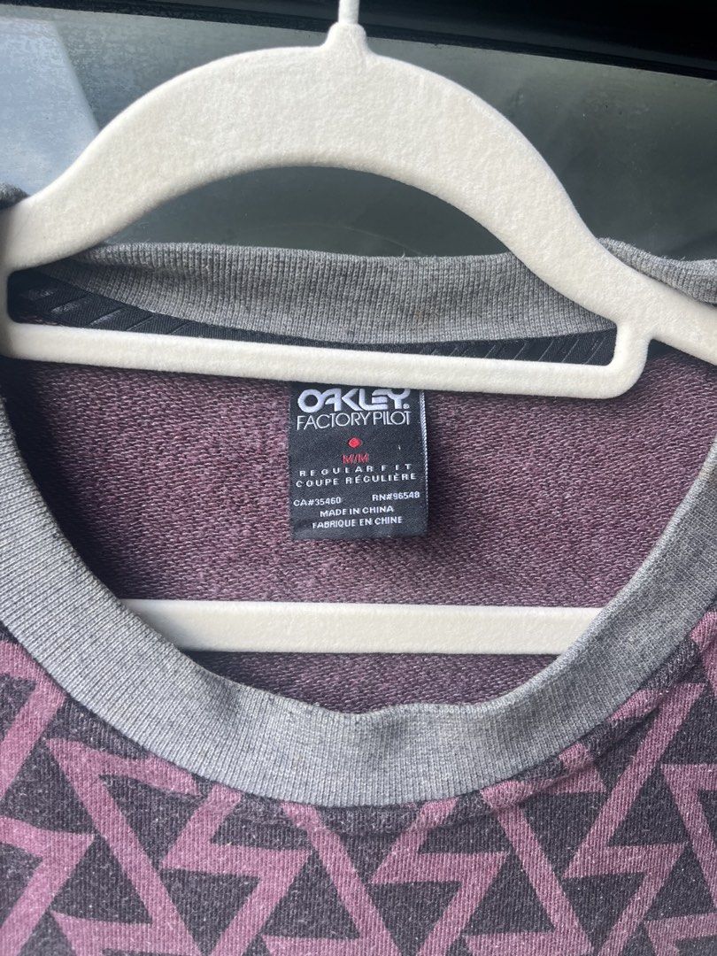 Oakley Factory Pilot Crewneck Sweatshirt (Category: Coats, Jackets and Outerwear) located in Manila. Submitted by kingjamessthriftt (Listing ID 1464005363, Image 3). Description: - Oakley Factory Pilot Sweatshirt - Crewneck, long sleeves - Grey main body with yellow chest stripe - Geometric pattern on upper part and sleeves - Size: Medium (M) - Made in China.
