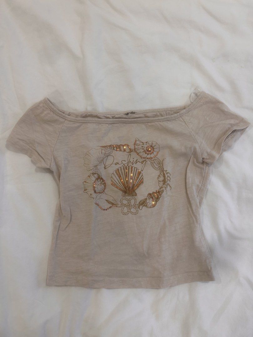 off shoulder beige beach shirt summer top (Category: Others Tops) located in Paranaque City. Submitted by bruised_soup (Listing ID 1464095469, Image 1). Description: cut tag since itchy rfs: decluttering mop: gcash / bank transfer mod: jnt / lalamove -> payment first before shipment -> sf shouldered by buyer -> first to pay gets the item -> no cancellations/returns 🏷️ y2k top, y2k baby tee, vintage baby tee, fitted top, cropped top, graphic tee,